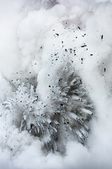 Lava tube flowing into ocean in Hawaii at dawn shows the extremely hot steal formed when the hot magma hits the ocean.