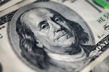 Close-up view of a 100 dollar bill with details, texture and vibrant colors. Perfect for finance, banking and wealth themes, vertical photo, wallpaper