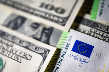 100 dollar bills and 100 euro bills close-up symbolize wealth, international finance, currency exchange and world economy, world currency market, competitors