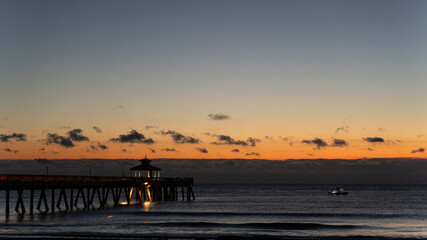 sunrise and pier on the beach