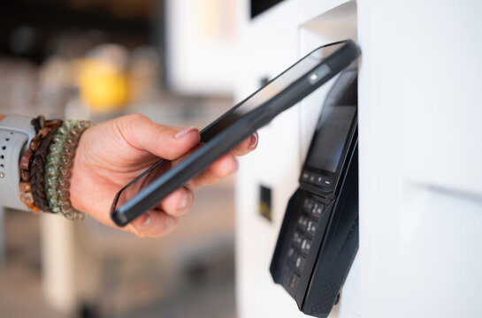 Girl Makes Contactless Payment With Smartphone At Nfc Terminal