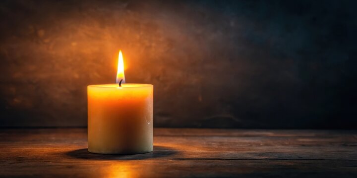 Softly flickering candle flame on a dark background, creating an intimate and cozy ambiance , light, glow,  light