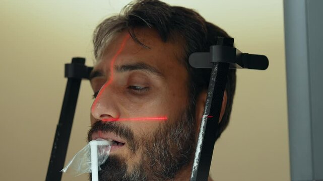 This video provides a close-up, steady view of a dental film taken on a dental tomography (CBCT) device. The detailed shot provides a clear view of the teeth and jaw structure.