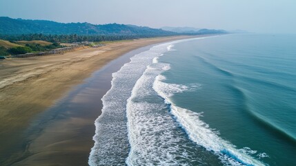 Fototapeta premium Serene Aerial View of Tranquil Beach and Gentle Waves at Dusk