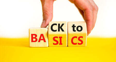 Back to basics symbol. Concept words Back to basics on wooden block. Beautiful yellow table white...