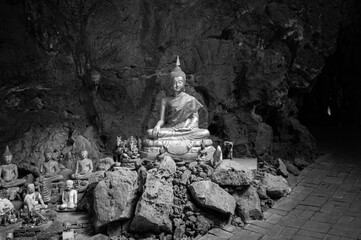 Statue of Buddha in Buddhism Cave in Thum Khao Luang in Phetchaburi Province, Thailand