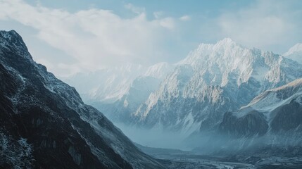 Obraz premium Majestic Snow-Capped Mountains with Serene Blue Sky and Clouds