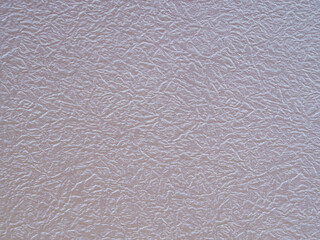 Aluminum colored textured background. Silver background from metal foil on cardboard decorative...