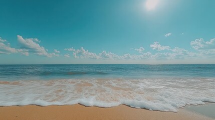 Sunny beach, ocean waves on sand.