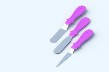 Row of cake decorating spatulas on light gray background. Confectionery tool. Professional equipment. Copy space. 3d rendering