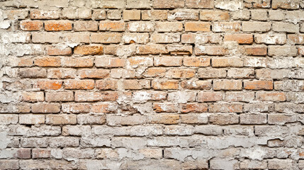 Fototapeta premium Aged brick wall with weathered texture and faded mortar details