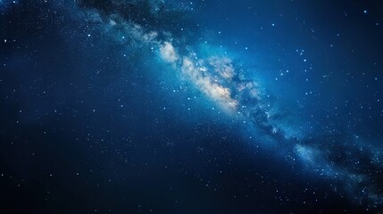 Fototapeta premium A stunning photo of the cosmos, featuring sparkling stars and an enormous galaxy against a brilliant blue backdrop