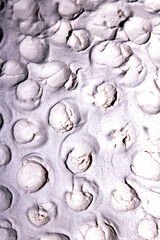 Crater Holes and Dips in Pottery Clay In a Thick White Texture Dots