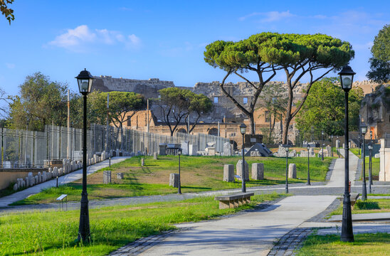 Cityscape of Rome, Italy: view of the Celio Archaeological Park with a glimpse of the Colosseum in the background.