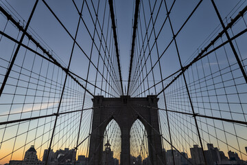 Brooklyn Bridge close up detail looking up at suspension cables at sunrise (beautiful landmark...