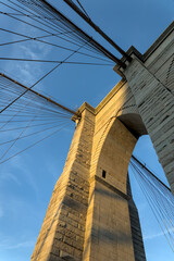 Brooklyn Bridge close up detail looking up at suspension cables at sunrise (beautiful landmark...