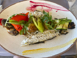 Sea fish for lunch. Dinner of fish fillet with vegetables