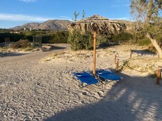 Beach. Sun lounger. Sun umbrella. Sunshade