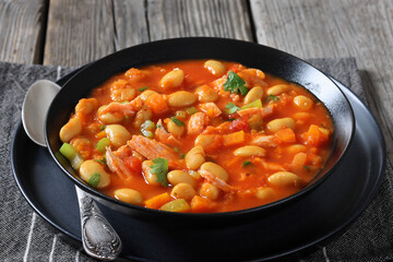 Pasulj, white bean soup with chicken in bowl