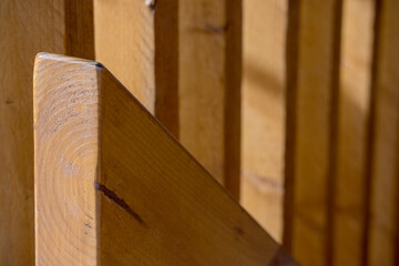 Close-up of a wooden staircase showing several wooden steps and railings.