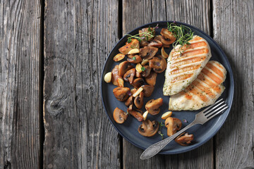 grilled chicken breasts with mushrooms, top view