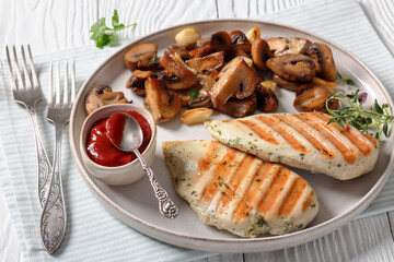 grilled chicken breasts with mushrooms, top view