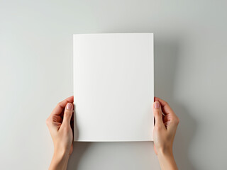 Blank Brochure Mockup:  A simple yet elegant mockup showcasing a blank brochure held by two hands, providing a clean and professional backdrop for your designs.  