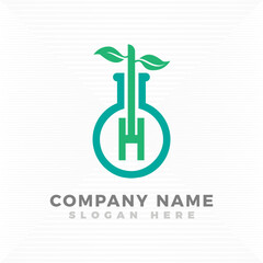 Obraz premium Test tube blended with initial letter H logo template