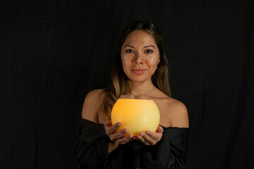 candle latina woman posing on camera with black background