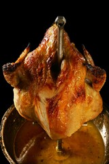 Golden Rotisserie Chicken on a Spit