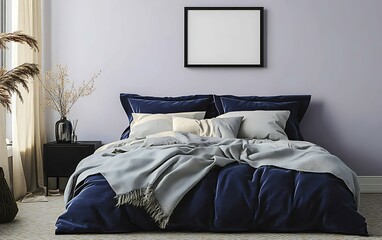 Stylish bedroom interior with navy blue velvet bedding, gray throw blanket, and pampas grass decor.