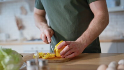 Cook hands slicing pepper on board home kitchen closeup. Woman making surprise