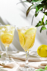 limoncello spritz in a glass on the table with lemons