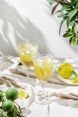 limoncello spritz in a glass on the table with lemons