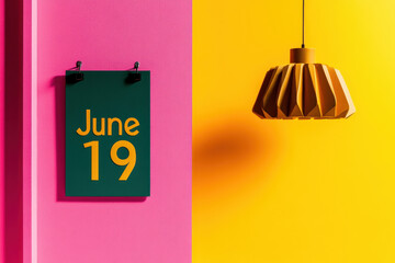 Vibrant Modern Design with June 19 Calendar Date and Stylish Geometric Lamp Against Bold Pink and Yellow Walls