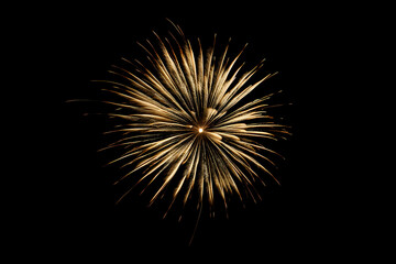golden fireworks in the night sky, with a dark background