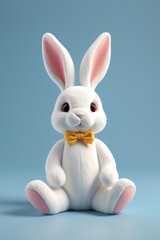 Obraz premium arafly white rabbit with a yellow bow tie sitting on a blue surface