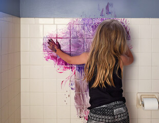 Messy Child Coloring with Paint on Wall at Home