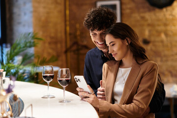 A loving couple enjoys a special moment together at a restaurant, sharing smiles and drinks.