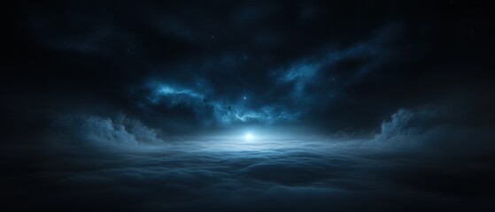 A dark sky with clouds and stars