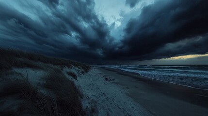 Dark, ominous clouds loom over a quiet beach as evening approaches, casting shadows on the sand and waves. The turbulent sky reflects the tension of an impending storm