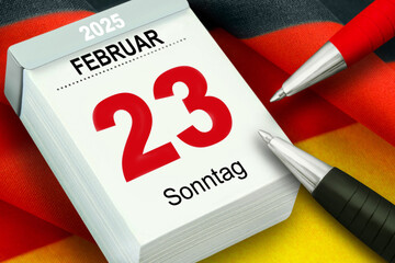 Deutscher Kalender Datum 23. Februar 2025 Sonntag und Deutsche Flagge mit Kugelschreiber