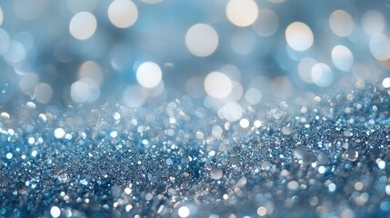 Fototapeta premium Sparkling blue bokeh background with shimmering glitter creating a dreamy and soft textured effect ideal for artistic designs and visuals