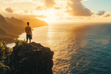 Fototapeta premium Man on Clifftop Overlooking Ocean Sunset