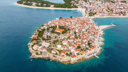 Primošten(Primosten), a picturesque coastal town on the Adriatic Sea in Croatia, captivates with...
