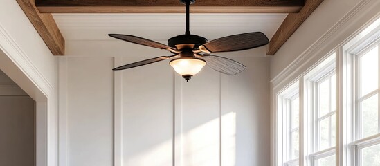 Stylish ceiling fan with light fixture in bright room showcasing pristine white walls and modern design elements