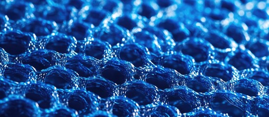 Vibrant blue plastic netting close up highlighting unique texture and pattern ideal for design and crafting applications