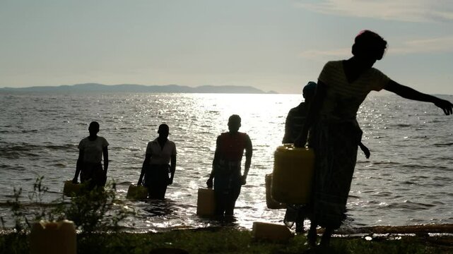 African womens transports a canister, reflecting the struggle of carrying water for drinking. Daily village life shows hardship, with water scarcity amid green forests.