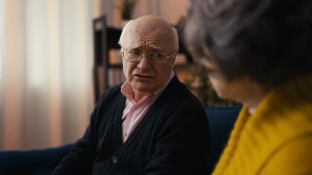 Elderly man complains about health issues to his female friend, who supports him
