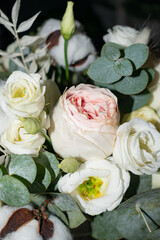 Close-up of blooming roses in a soft pastel bouquet. A beautiful floral arrangement perfect for celebrations or greeting cards.